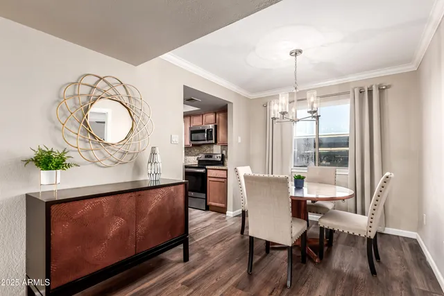 a view of a dining room with furniture window and wooden floor