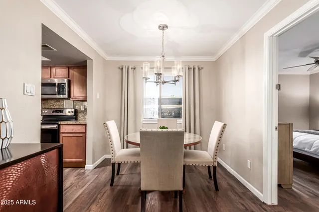 a view of a dining room with furniture large window and wooden floor