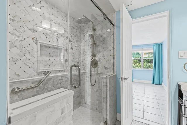 an aerial view of a house with a yard and trees