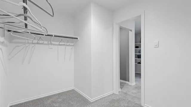 a bathroom with a double vanity sink and mirror