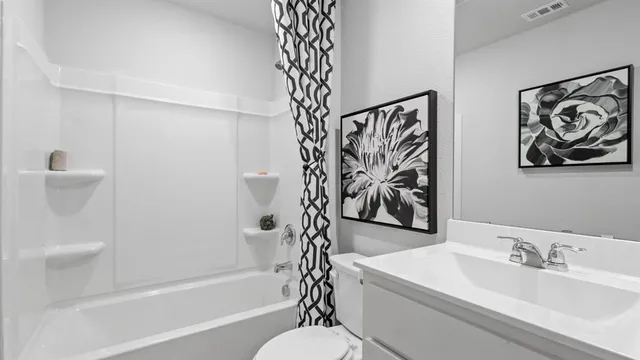 a bathroom with a bathtub a shower and a sink