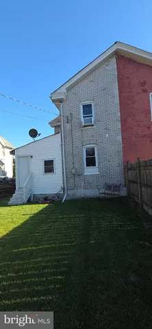 a bathroom with a toilet a sink and a mirror