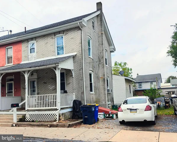 a kitchen with stainless steel appliances granite countertop a refrigerator a sink and dishwasher