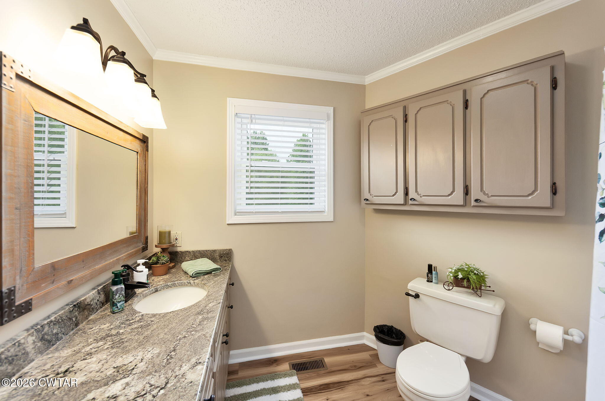 328 New Hope Road Ripley, TN 38063 - Photo 22 of 39 a bathroom with a granite countertop toilet sink and mirror