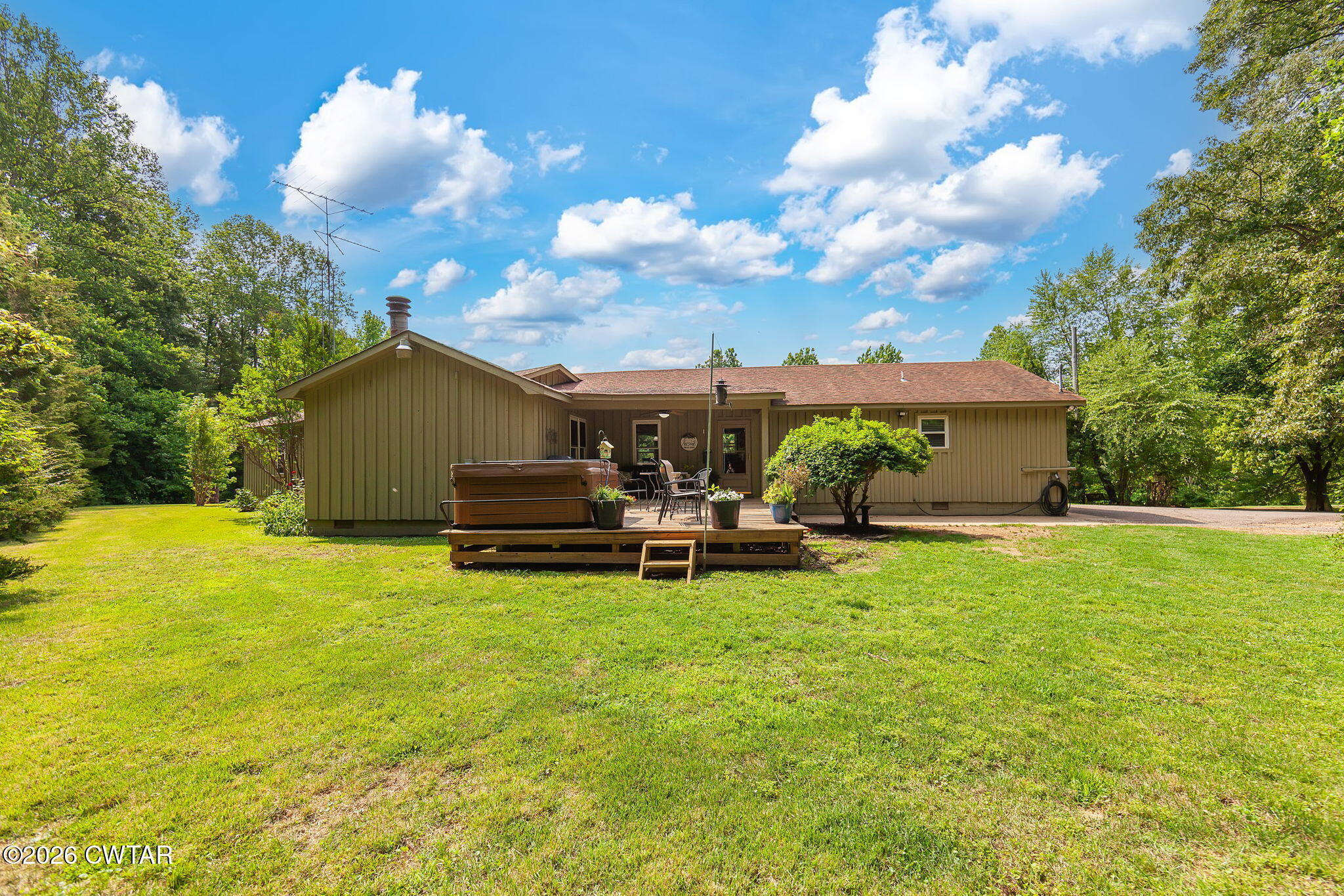 328 New Hope Road Ripley, TN 38063 - Photo 30 of 39 a view of a house with backyard and sitting area