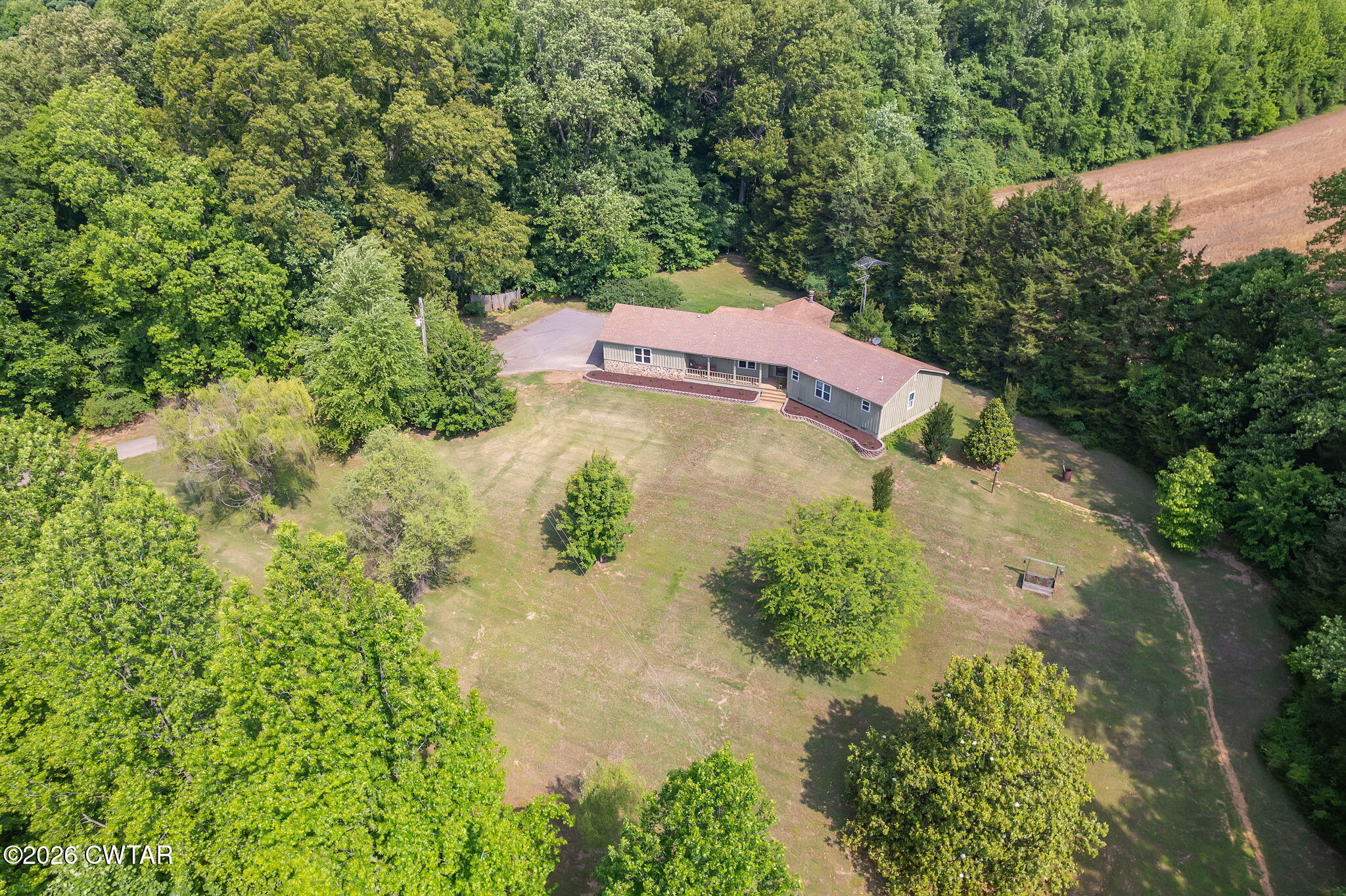 328 New Hope Road Ripley, TN 38063 - Photo 31 of 39 an aerial view of a house with a yard