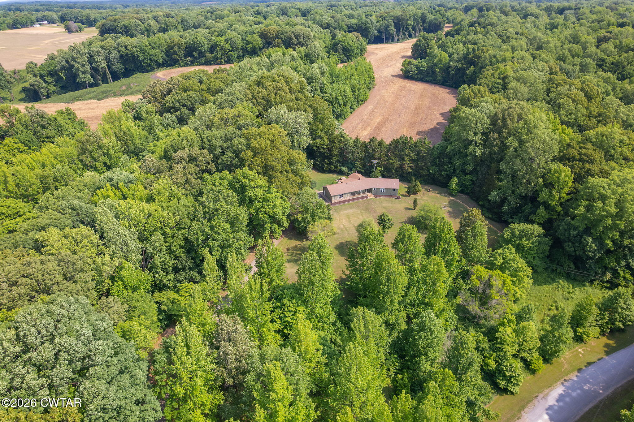 328 New Hope Road Ripley, TN 38063 - Photo 39 of 39 an aerial view of residential house with outdoor space and trees all around