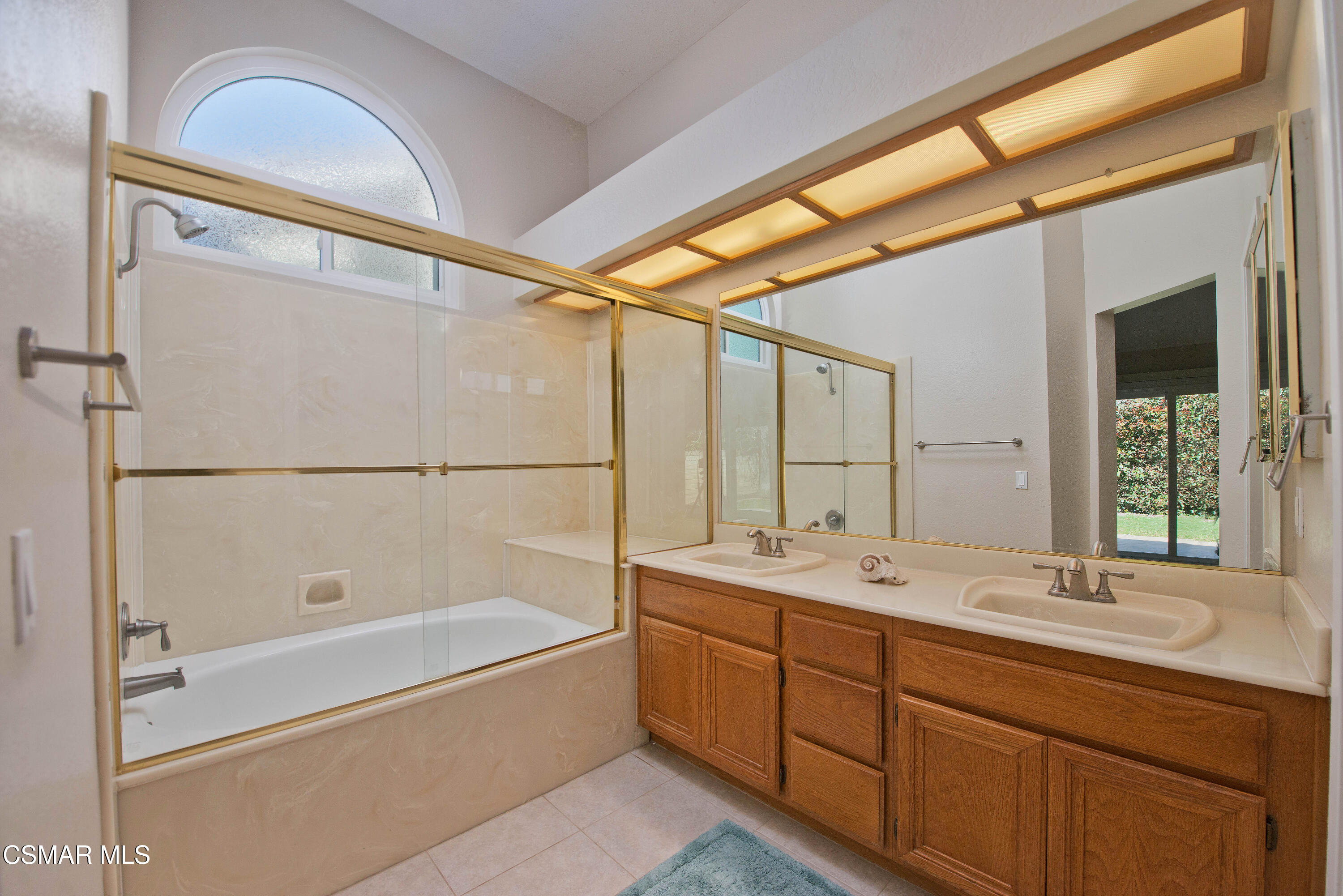 65 Iron Ridge Lane Simi Valley, CA 93065 - Photo 17 of 33 a bathroom with a tub sink shower and mirror