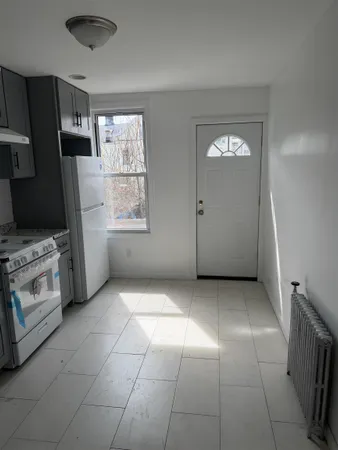 a view of a kitchen with washer and dryer