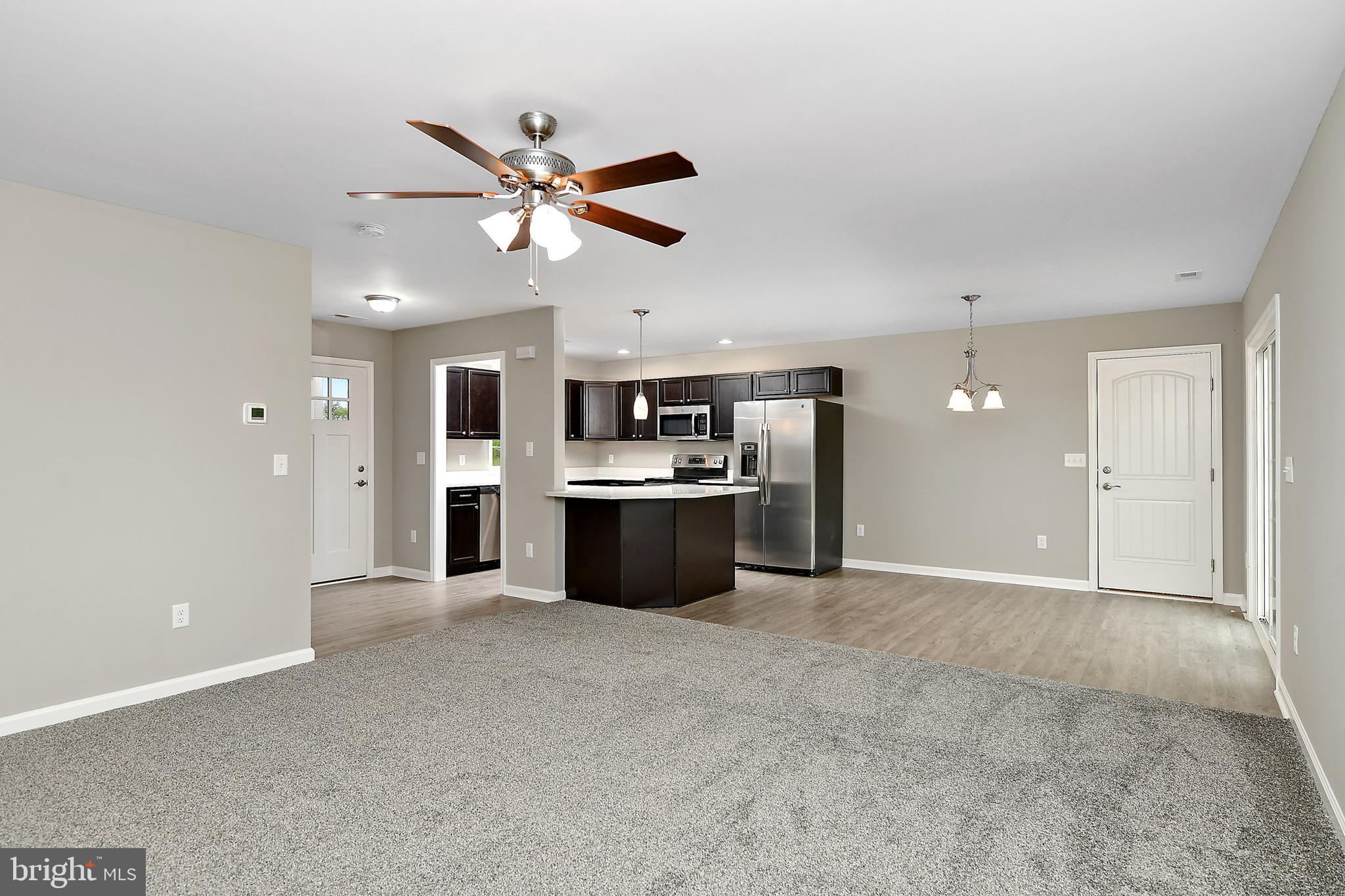 153 Fooks Road Bishopville, MD 21813 - Photo 7 of 30 a view of a kitchen with a sink and cabinet