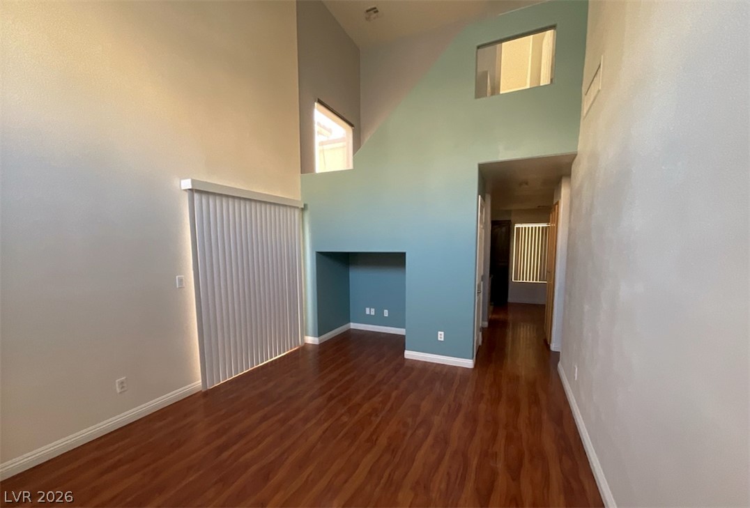 7203 Cestrum Road Las Vegas, NV 89113 - Photo 4 of 22 Soaring ceilings and rich wood floors define this architectural living space.