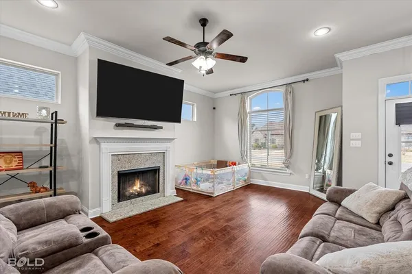 a living room with furniture fireplace and flat screen tv