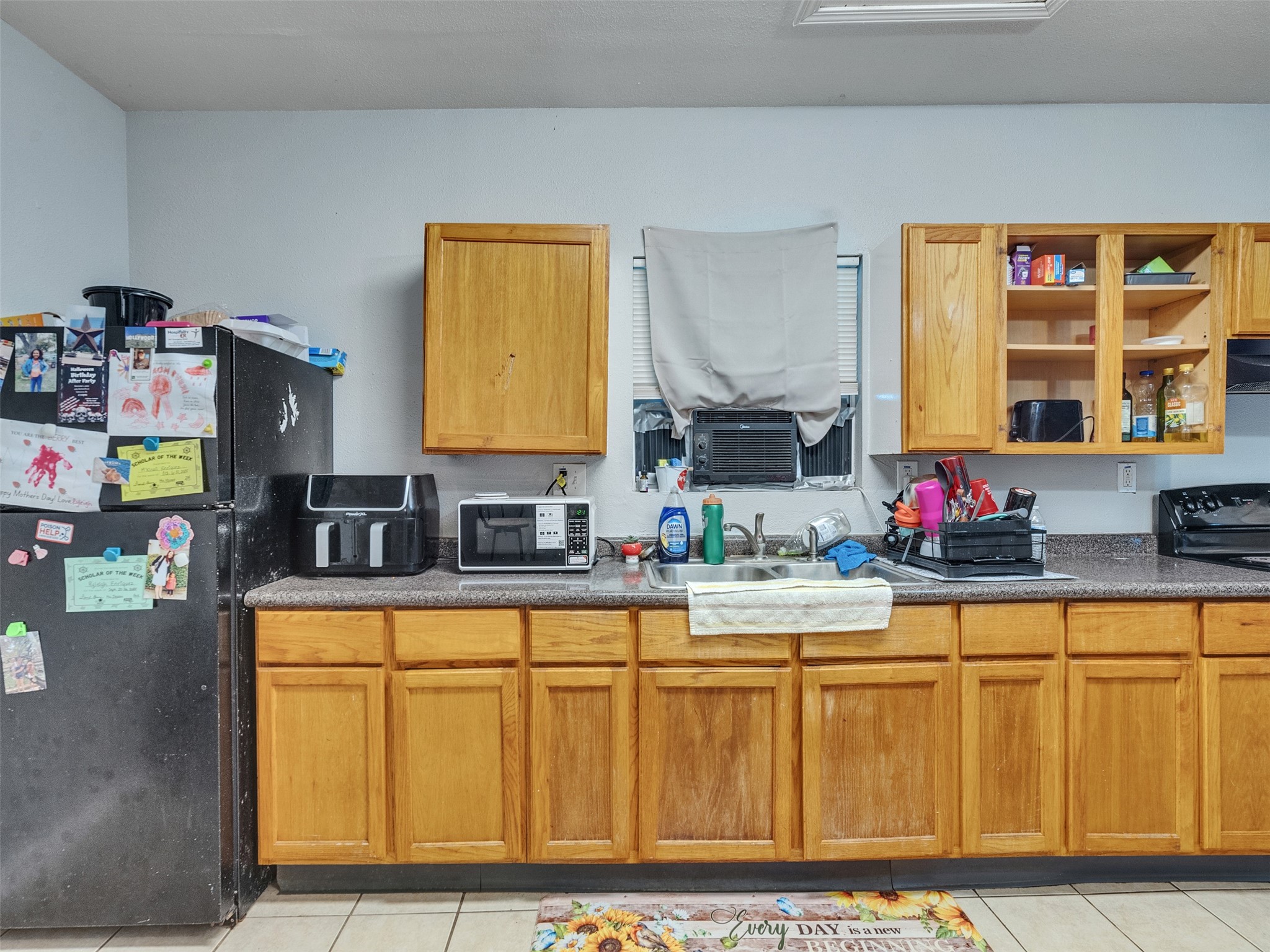 4323 Avenue R 1/2 Galveston, TX 77550 - Photo 11 of 41 Kitchen (Front Unit):
A closer look at the kitchen shows ample cabinet storage and natural light. Freshly painted walls make the space feel refreshed and ready for your personal touch.