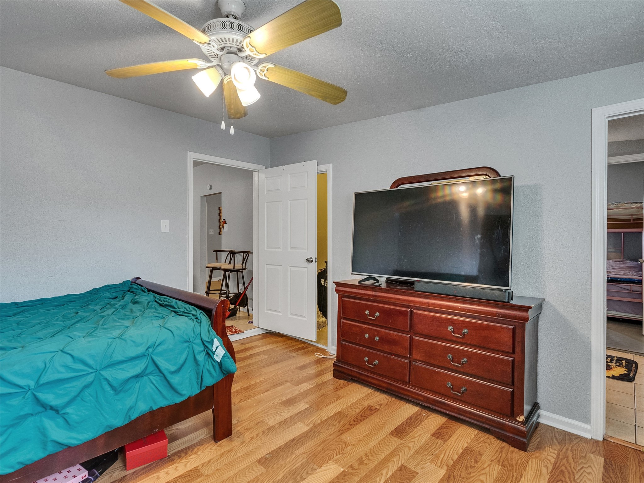 4323 Avenue R 1/2 Galveston, TX 77550 - Photo 14 of 41 Bedroom 1 (Front Unit):
Warm wood floors and freshly painted walls make this bedroom feel welcoming and cozy. A great place to relax and recharge after a long day.