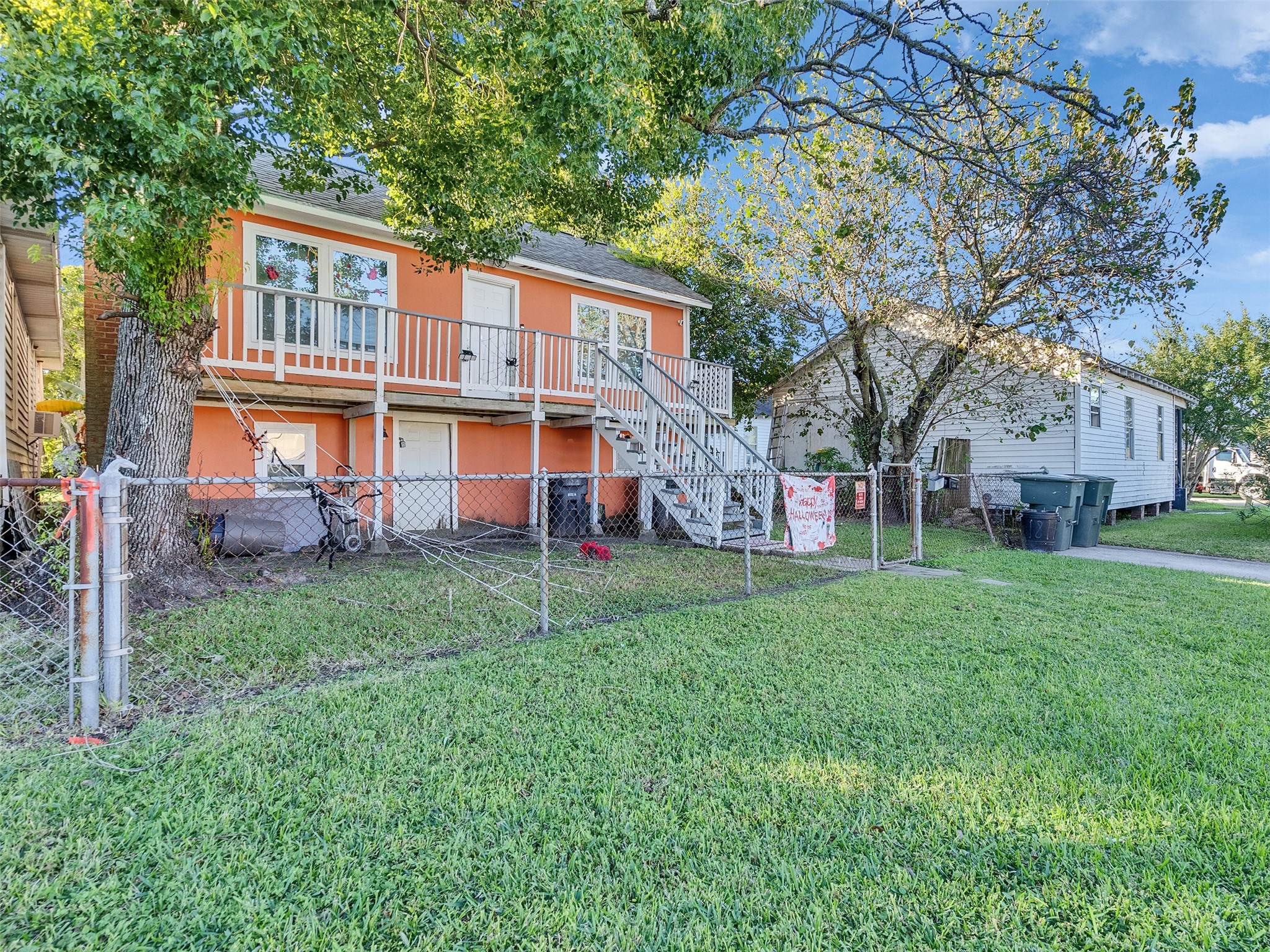 4323 Avenue R 1/2 Galveston, TX 77550 - Photo 2 of 41 The front entry shows off the home’s bright exterior and raised structure, perfect for island weather. A few steps up lead you to your private front porch—an easy spot to relax and enjoy the breeze.