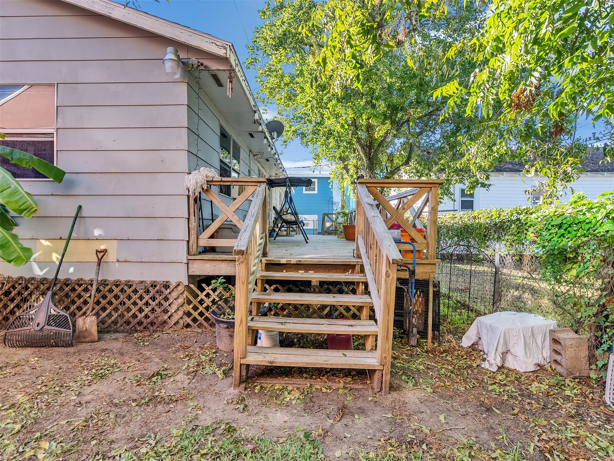 4323 Avenue R 1/2 Galveston, TX 77550 - Photo 23 of 41 From Backyard, Stairs Upstairs to Deck:
From the backyard, you can see the staircase leading to the upper deck—offering private access and a nice view of the property.