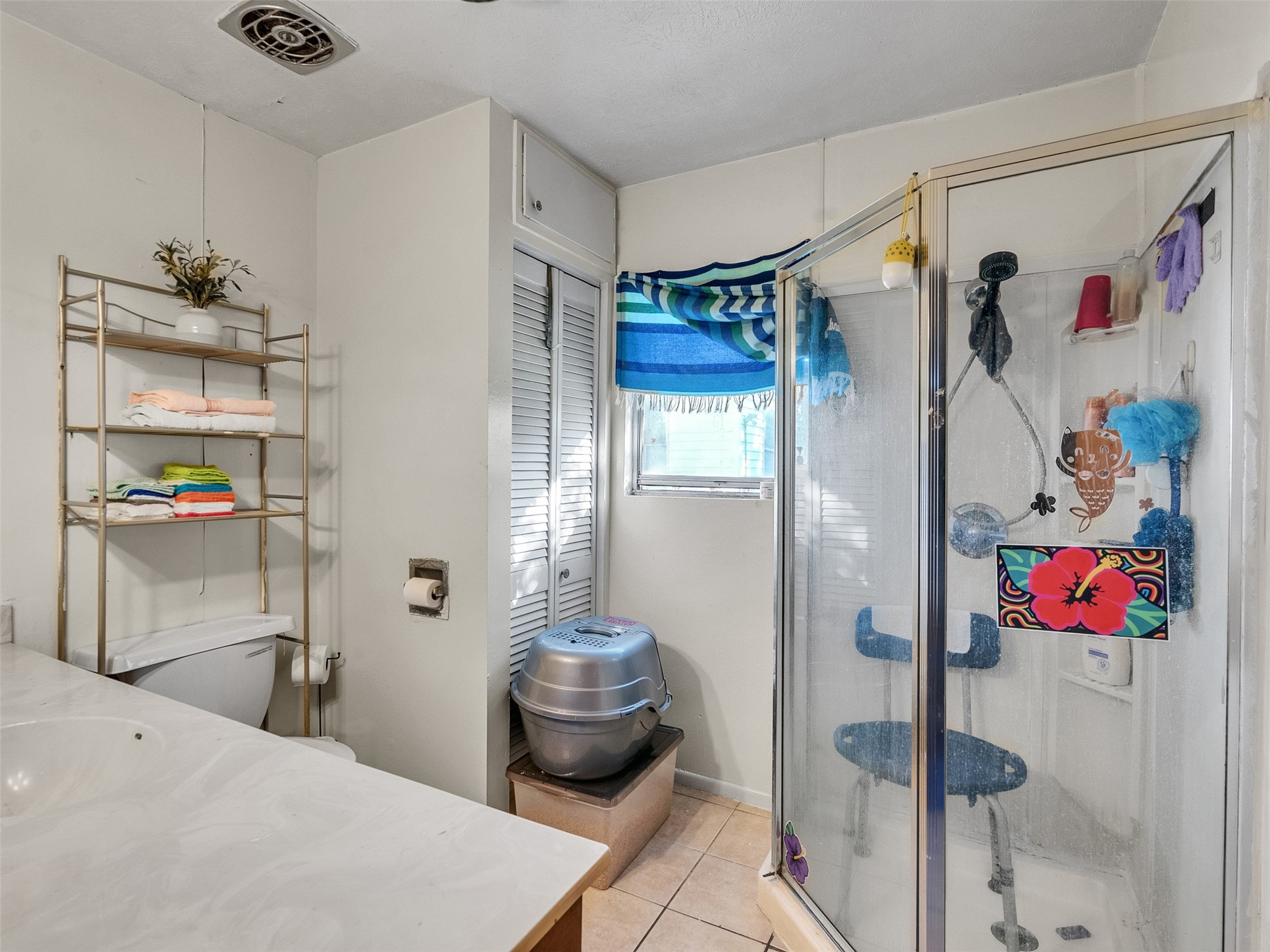 4323 Avenue R 1/2 Galveston, TX 77550 - Photo 40 of 41 Bathroom (Rear Unit):
A clean, functional bathroom with a shower enclosure, vanity, and toilet. Simple, practical, and ready to use.