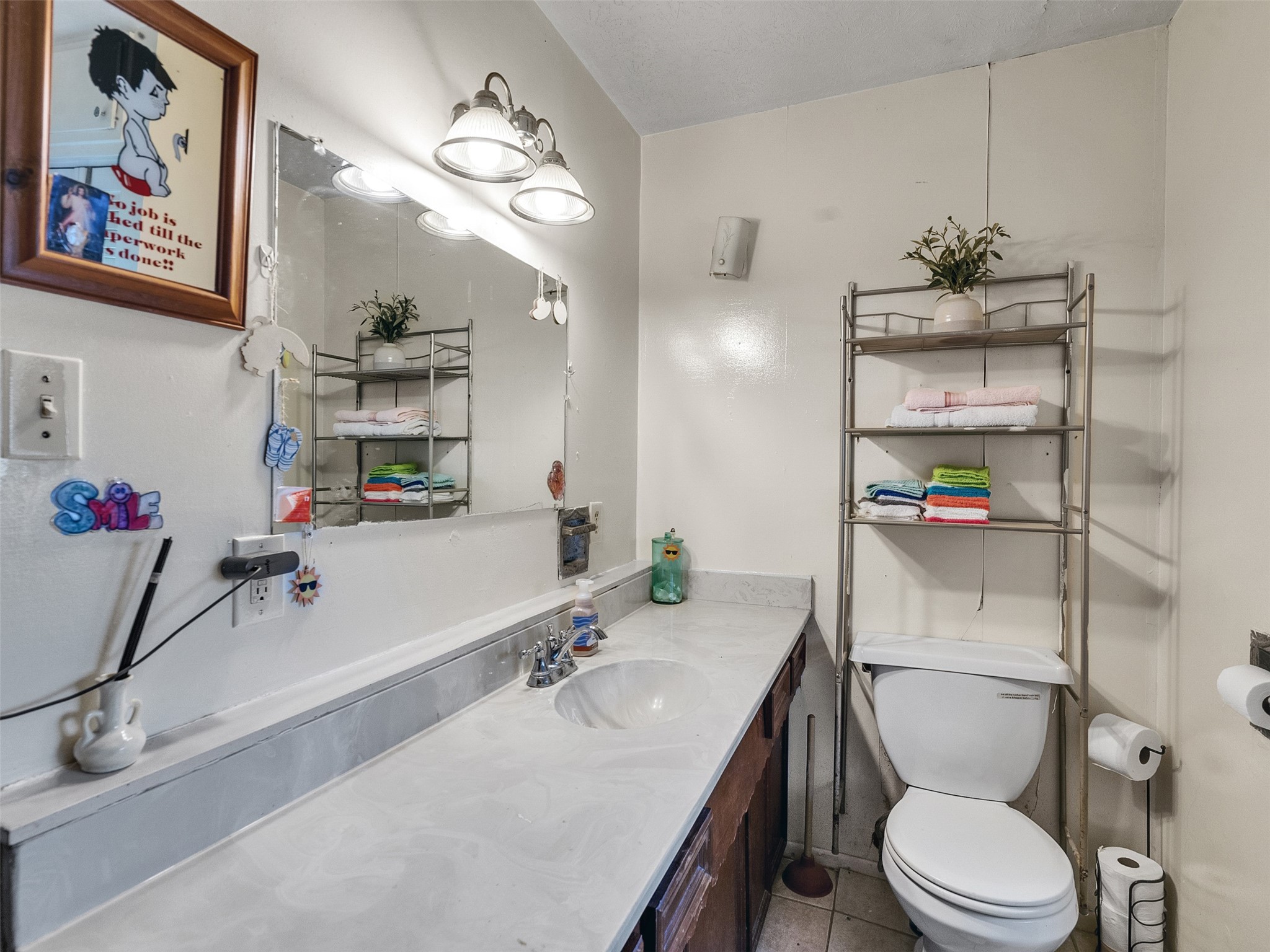 4323 Avenue R 1/2 Galveston, TX 77550 - Photo 41 of 41 Bathroom (Rear Unit):
Another angle of the bathroom shows its easy-care design and tile finishes. It’s a convenient space for daily routines or guest use.