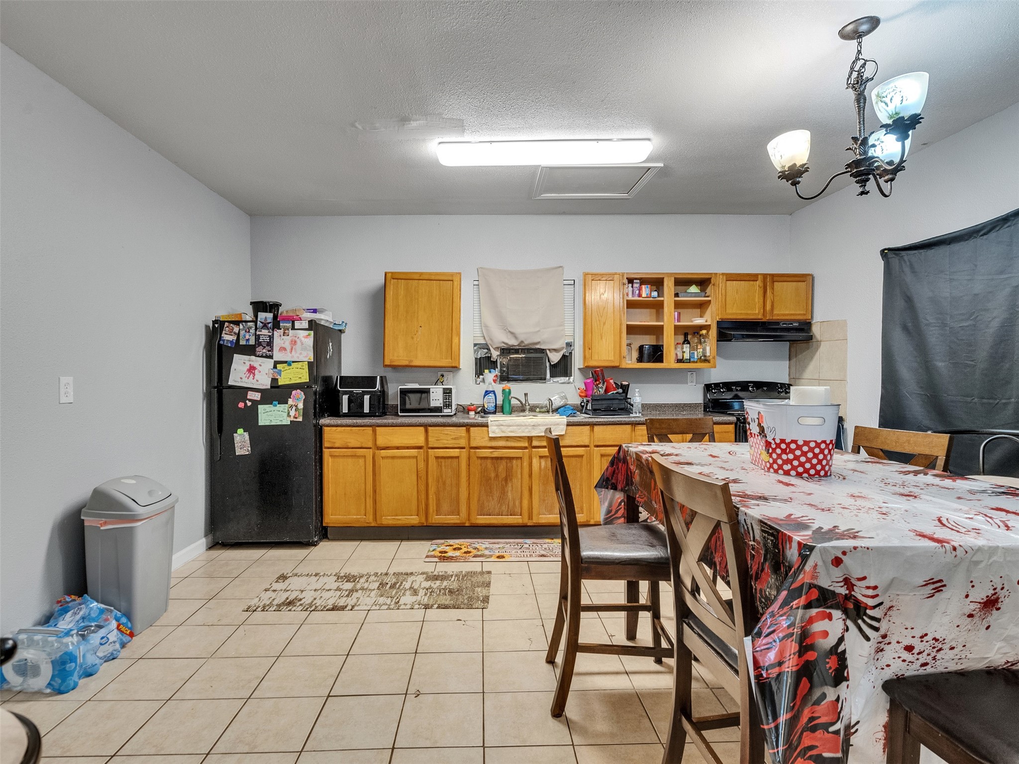 4323 Avenue R 1/2 Galveston, TX 77550 - Photo 7 of 41 Kitchen (Front Unit):
The kitchen offers function and simplicity, featuring easy-to-clean tile floors, included microwave, and efficient counter space. It’s the kind of kitchen that makes cooking at home comfortable and manageable.