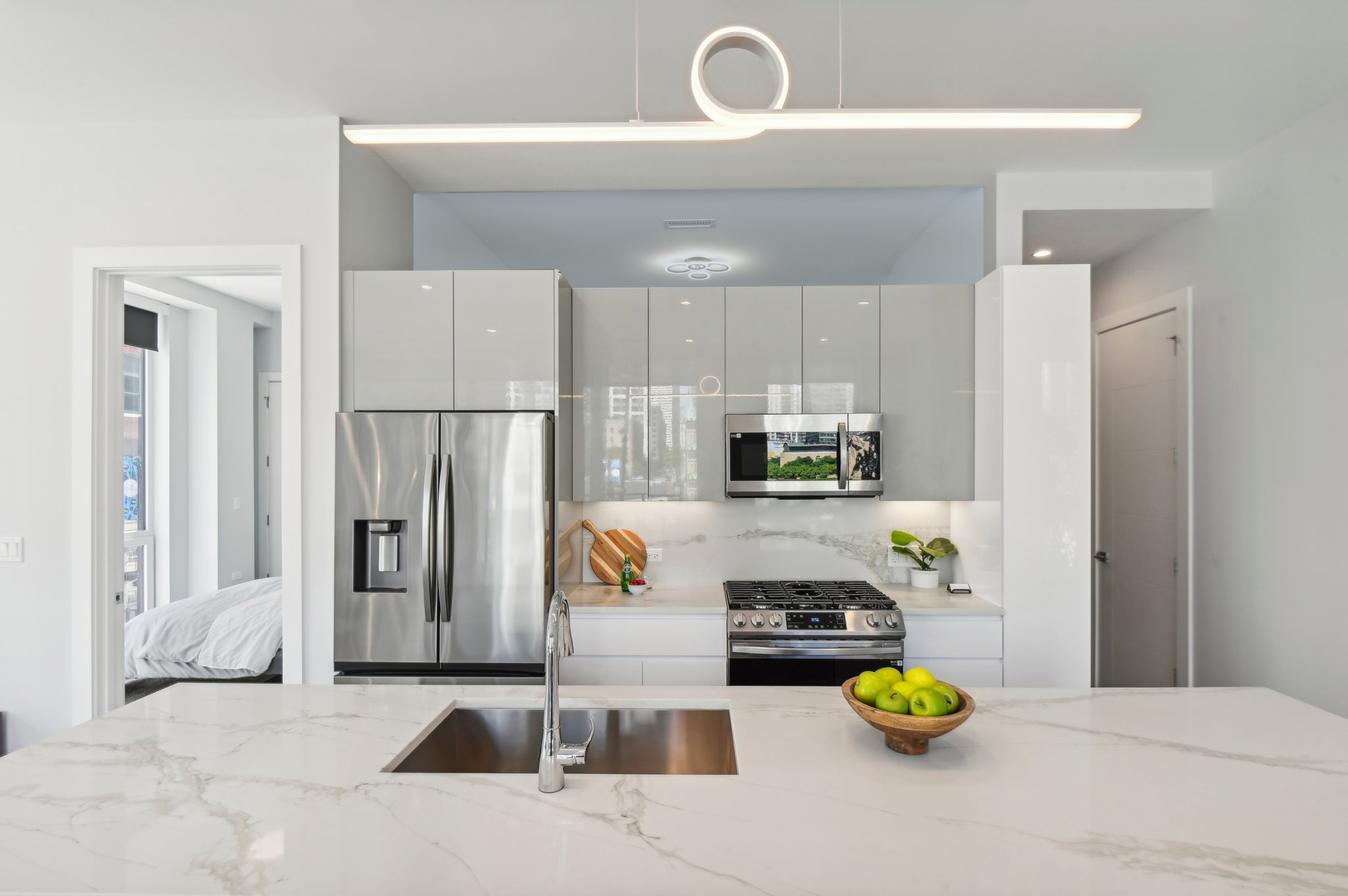 812 West Adams Street, Unit 600 Chicago, IL 60607 - Photo 14 of 46 a kitchen with a refrigerator and a stove top oven
