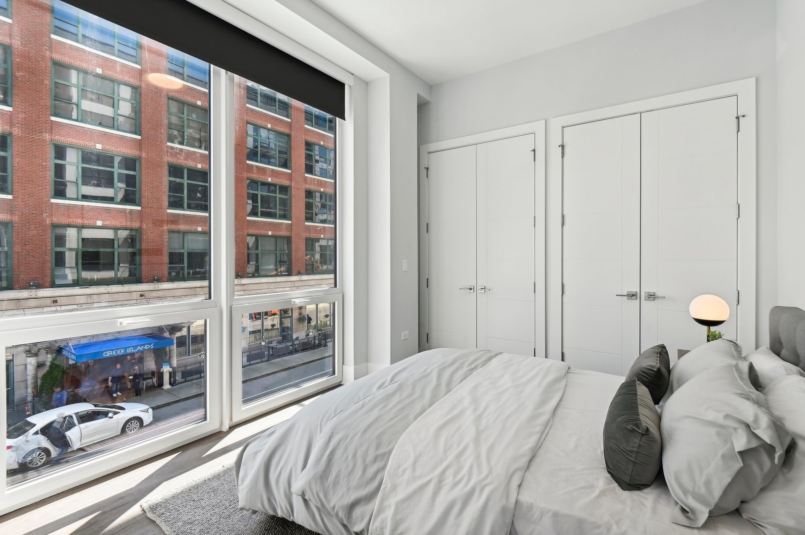 812 West Adams Street, Unit 600 Chicago, IL 60607 - Photo 27 of 46 a bedroom with a bed and a large window with outer view