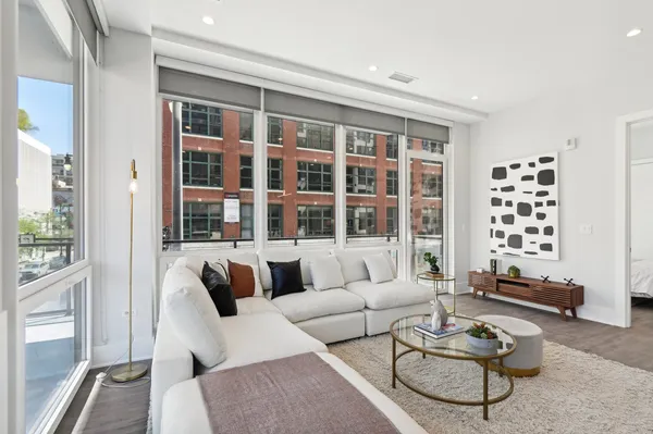 a living room with furniture and a window