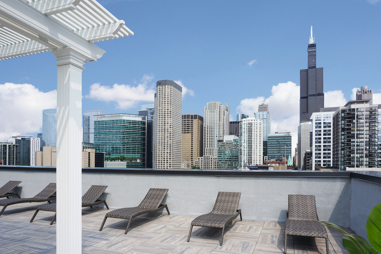 812 West Adams Street, Unit 600 Chicago, IL 60607 - Photo 35 of 46 a view of a city from a balcony with furniture