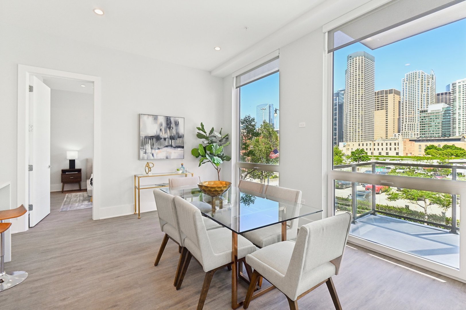 812 West Adams Street, Unit 600 Chicago, IL 60607 - Photo 10 of 46 a dining room with furniture a rug and a floor to ceiling window