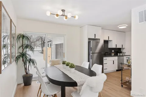 a kitchen with a table and chairs