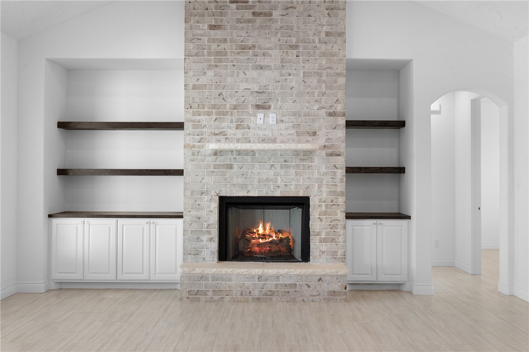6524 Agave Court Bryan, TX 77808 - Photo 15 of 43 a living room with a fireplace