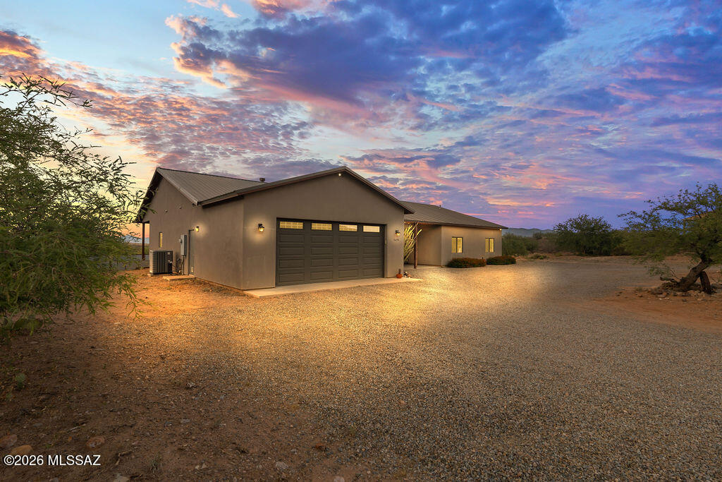 16276 East Empire View Road Vail, AZ 85641 - Photo 3 of 51 a yellow house with a yard in front of it