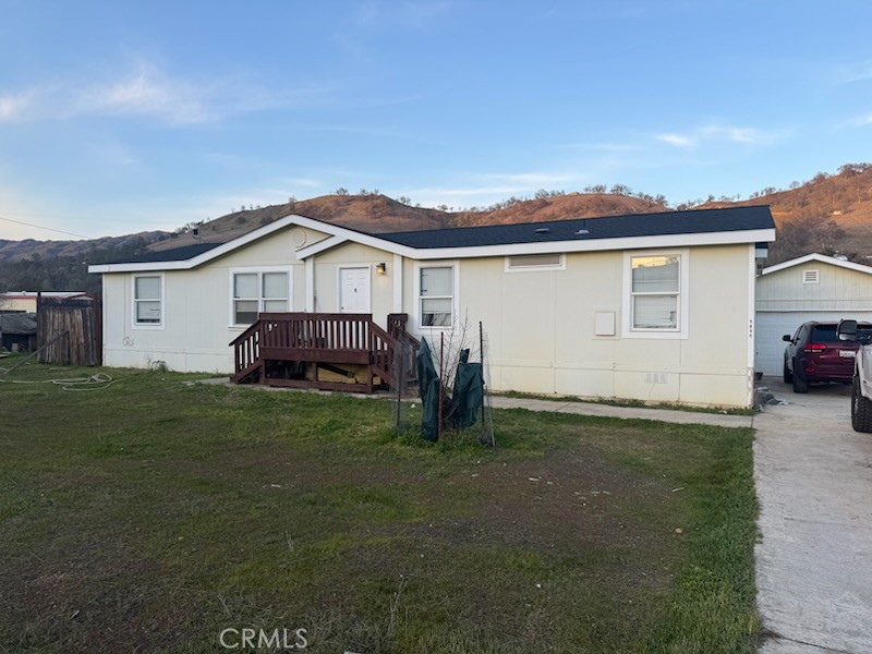 3096 Spring Valley Road Clearlake Oaks, CA 95423 - Photo 1 of 7 a view of a house with a yard