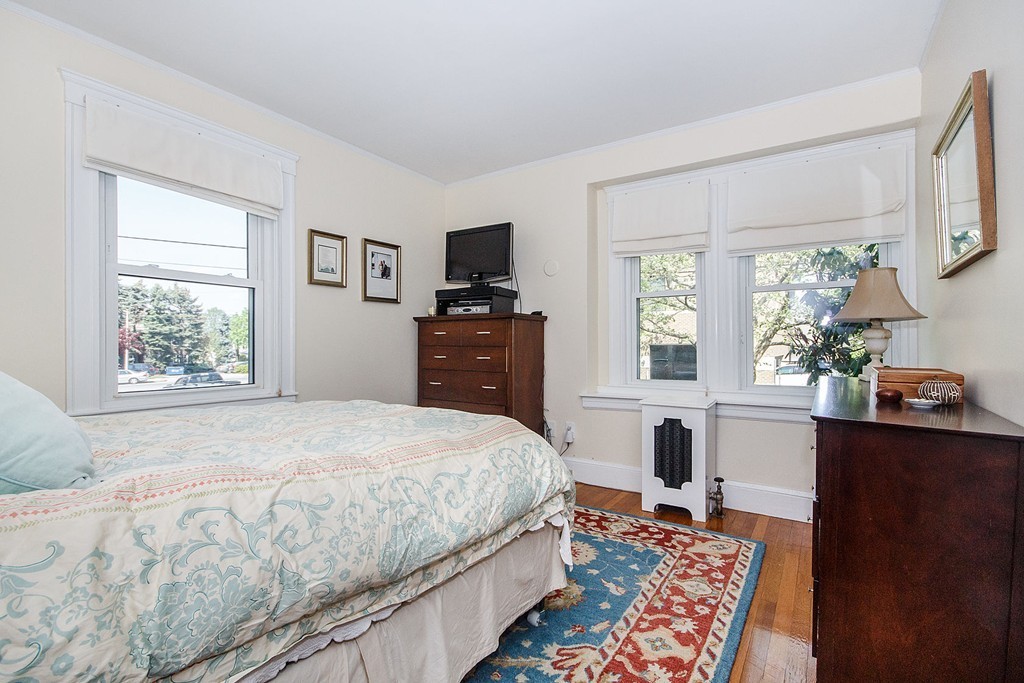 21 Watson Road, Unit 21 Belmont, MA 02478 - Photo 11 of 20 a bedroom with a bed and a table in it with window