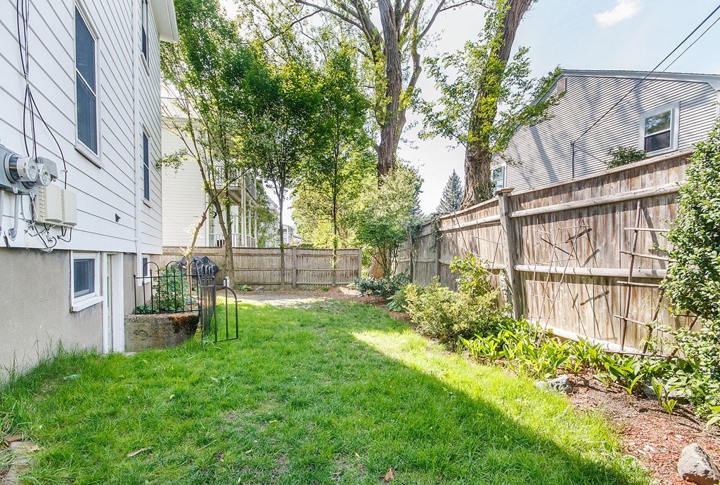 21 Watson Road, Unit 21 Belmont, MA 02478 - Photo 18 of 20 a backyard of a house with lots of green space