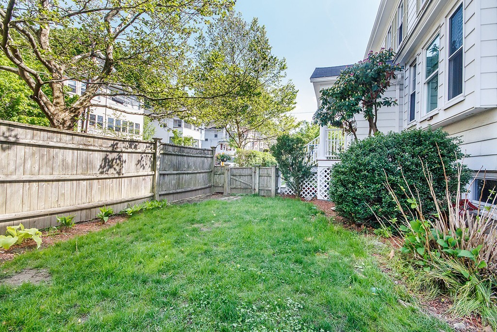 21 Watson Road, Unit 21 Belmont, MA 02478 - Photo 19 of 20 a view of backyard with deck and garden