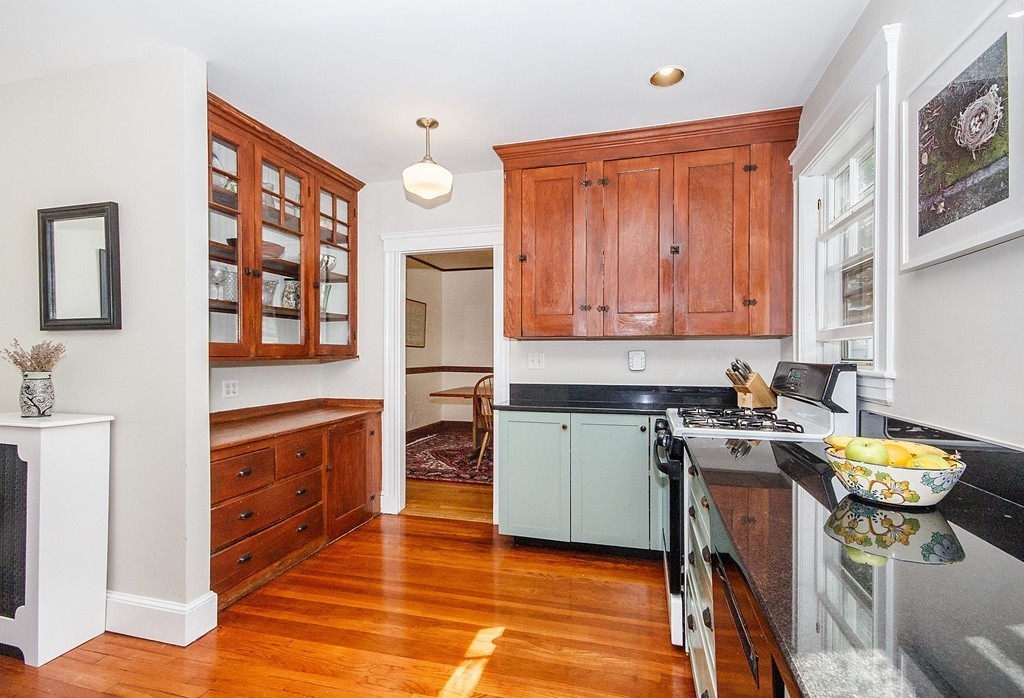 21 Watson Road, Unit 21 Belmont, MA 02478 - Photo 3 of 20 a kitchen with stainless steel appliances granite countertop a stove a sink dishwasher and a refrigerator with wooden floor