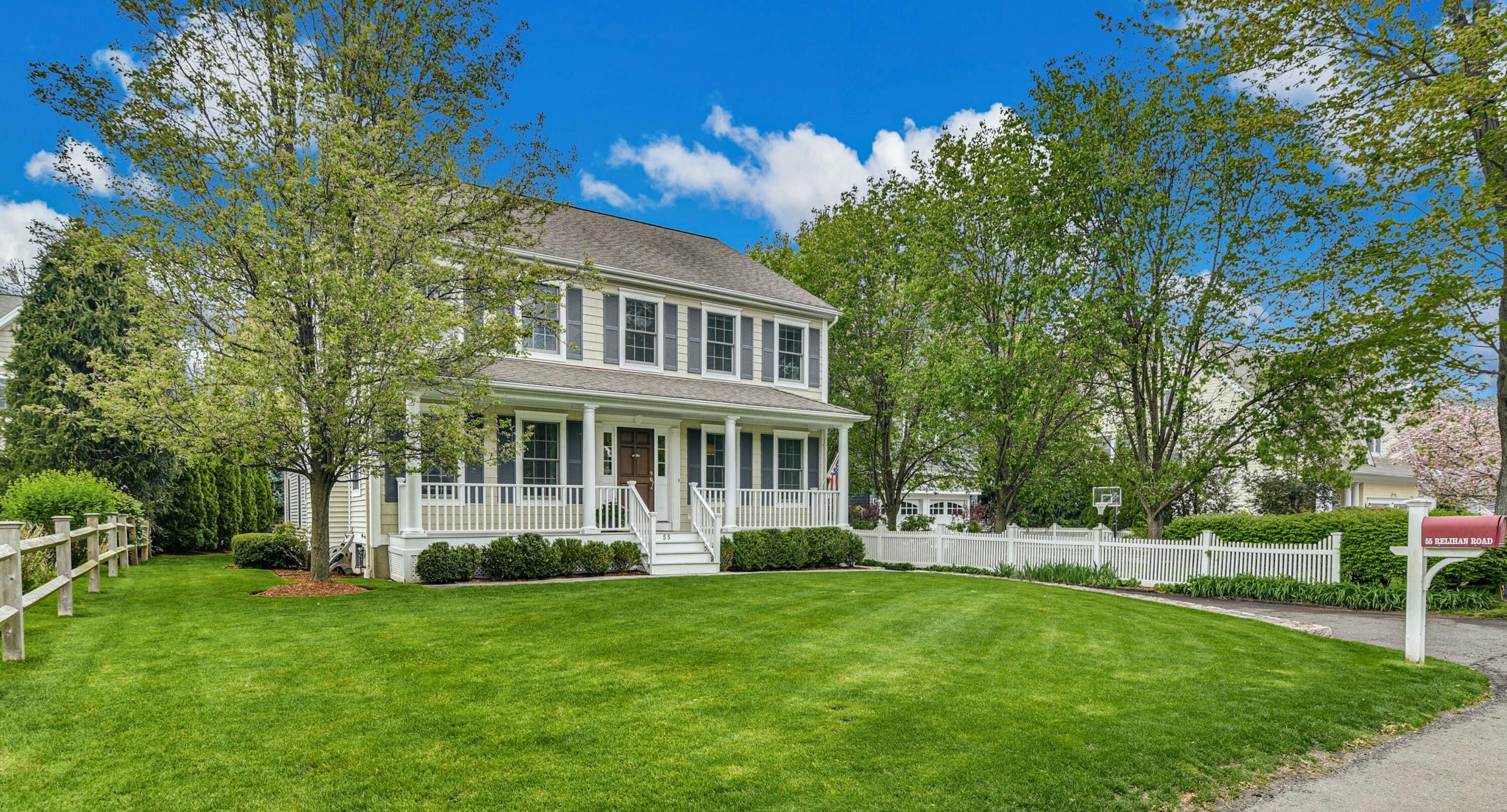 55 Relihan Road Darien, CT 06820 - Photo 1 of 1 a front view of a house with a garden