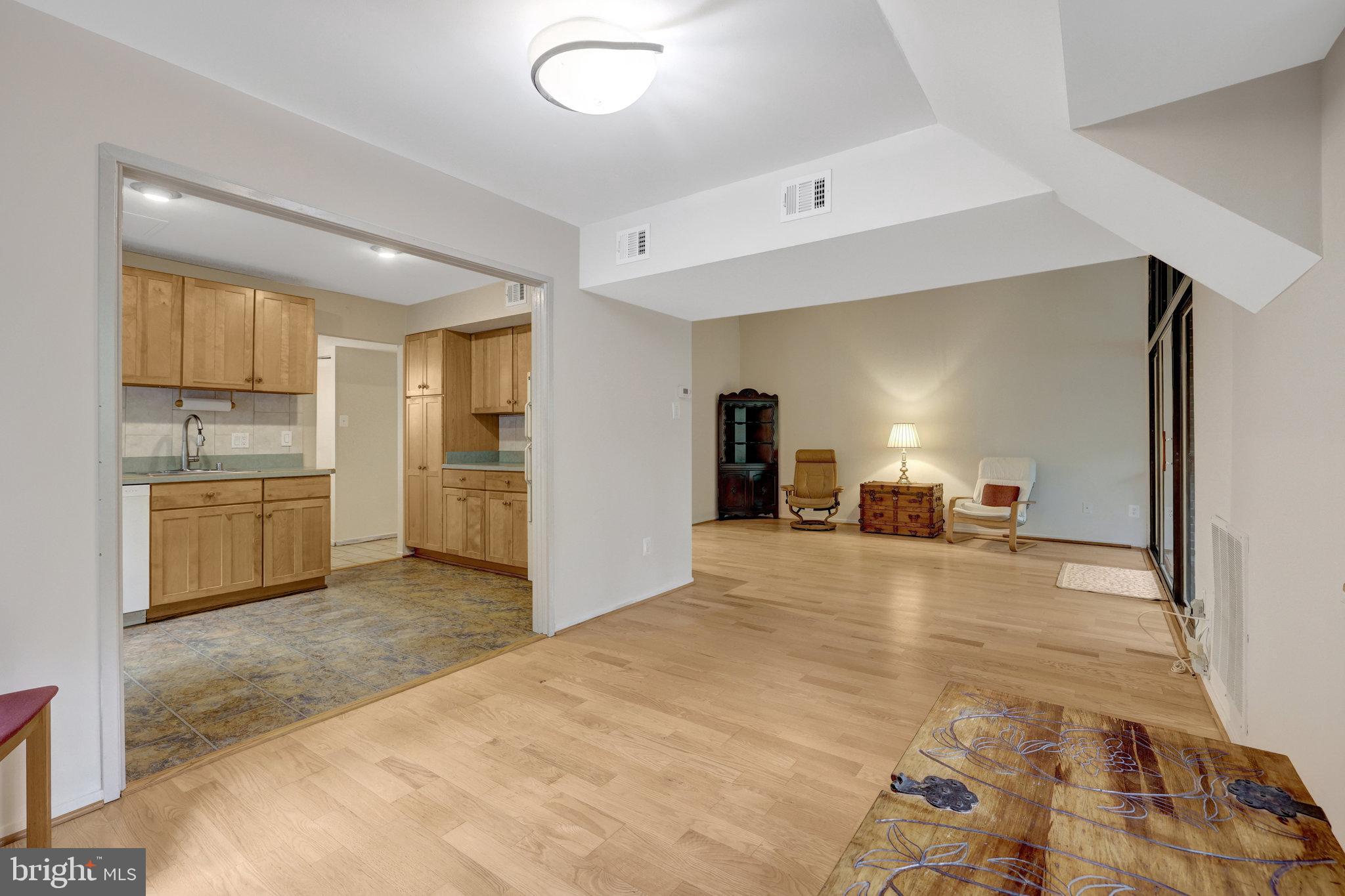 1665 Parkcrest Circle, Unit 301 Reston, VA 20190 - Photo 16 of 36 a view of a kitchen with a sink cabinet and a refrigerator