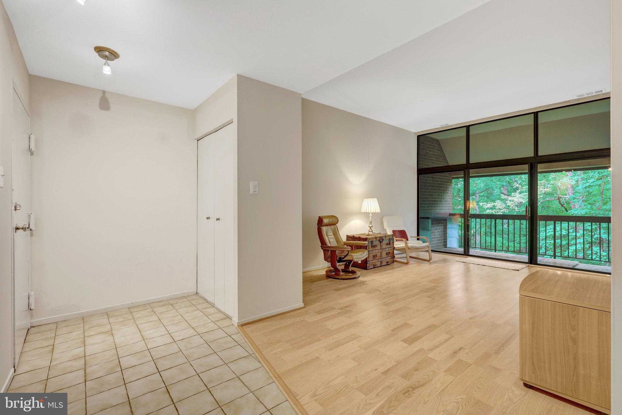 1665 Parkcrest Circle, Unit 301 Reston, VA 20190 - Photo 20 of 36 a view of a livingroom with lounge chair and a large window