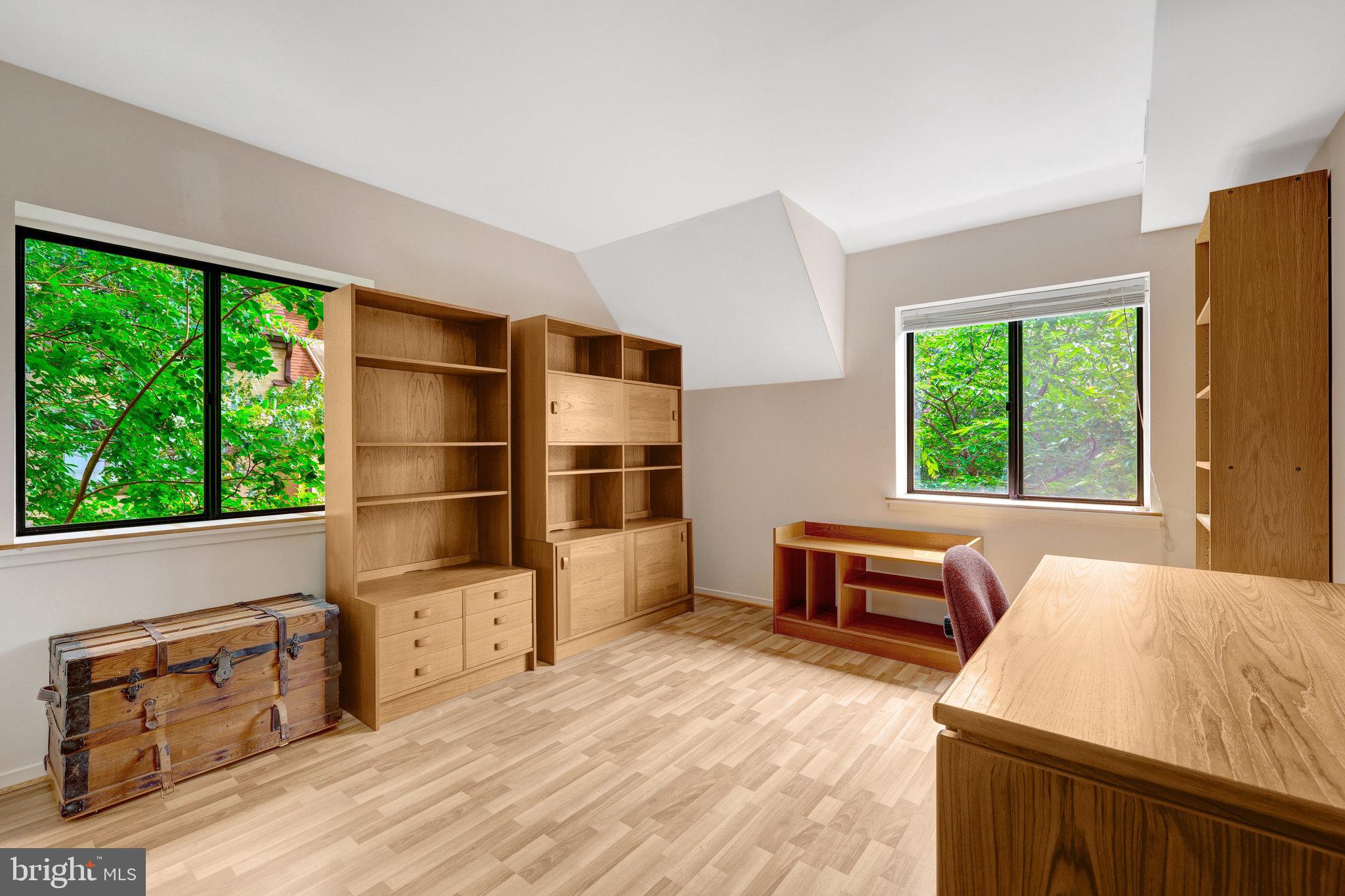 1665 Parkcrest Circle, Unit 301 Reston, VA 20190 - Photo 23 of 36 a bedroom with furniture and window