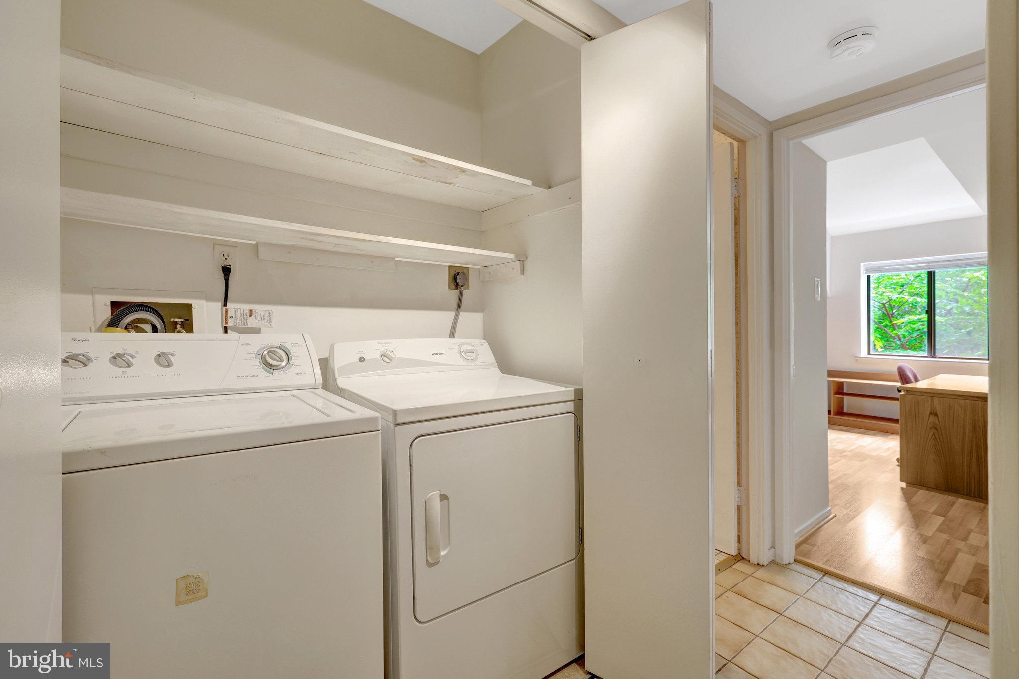 1665 Parkcrest Circle, Unit 301 Reston, VA 20190 - Photo 27 of 36 a utility room with dryer and washer