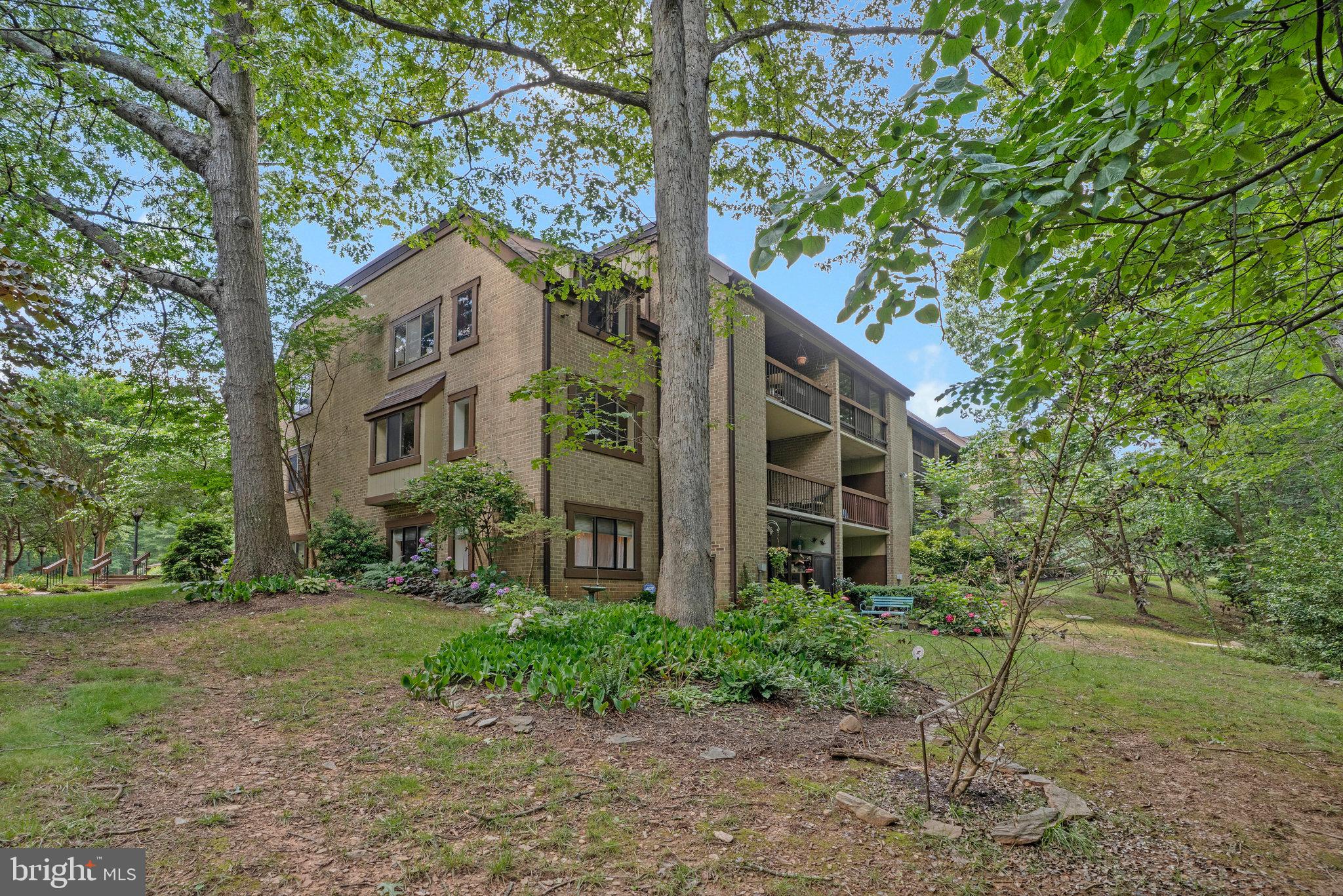 1665 Parkcrest Circle, Unit 301 Reston, VA 20190 - Photo 3 of 36 a view of a house with yard and sitting area