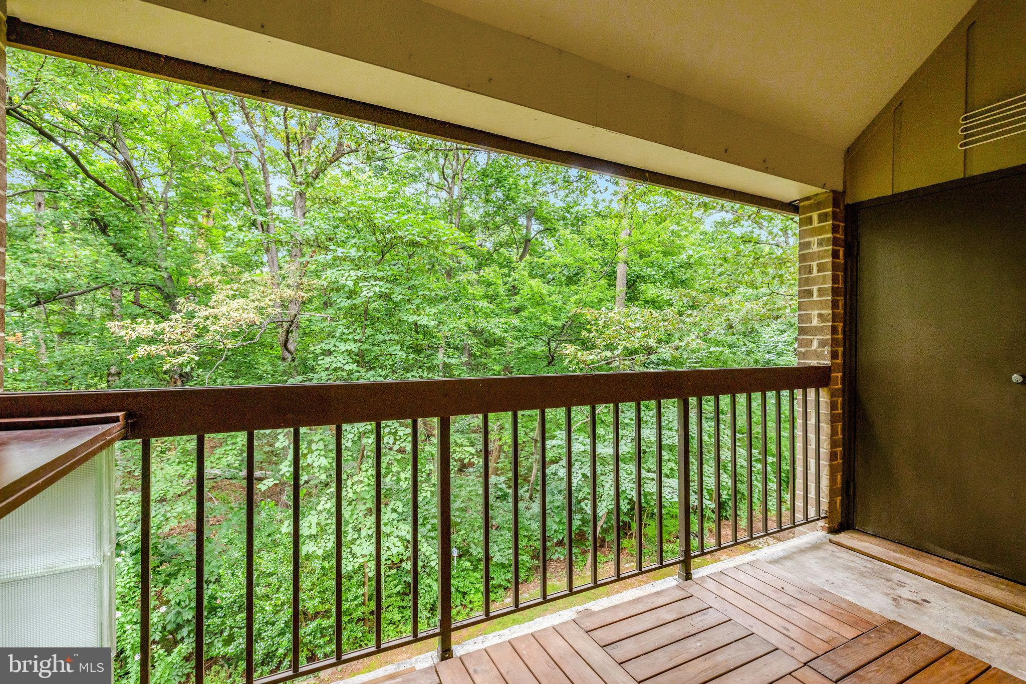 1665 Parkcrest Circle, Unit 301 Reston, VA 20190 - Photo 8 of 36 a view of balcony with wooden floor
