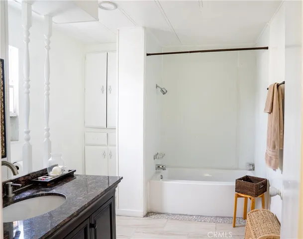 a bathroom with a sink and a bath tub