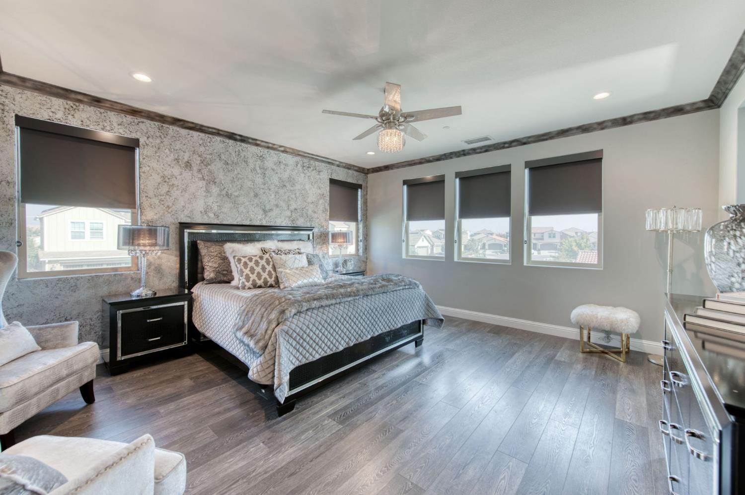 273 Meridian Avenue Madera, CA 93636 - Photo 16 of 55 a bedroom with a bed wooden floor and window