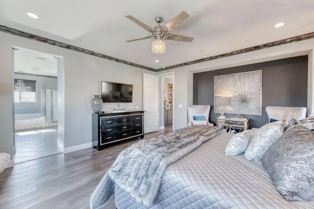 a spacious bathroom with a granite countertop sink mirror and shower