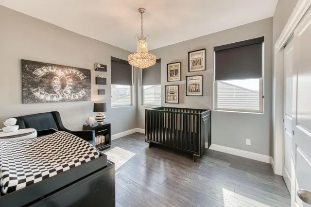 a bedroom with double bed and a window