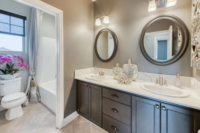 a kitchen with a sink appliances and cabinets