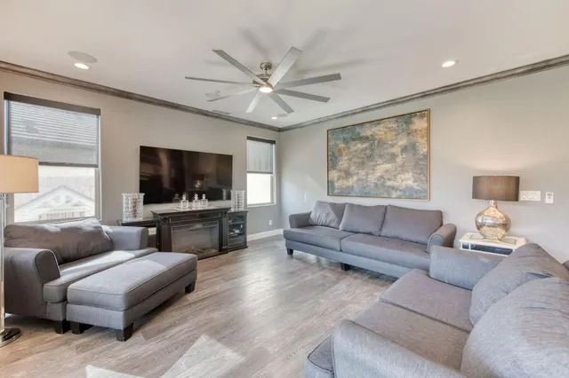 a kitchen with a dining table chairs sink and cabinets