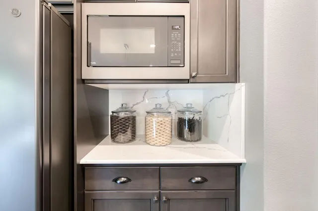 a view of a porch with furniture and a yard